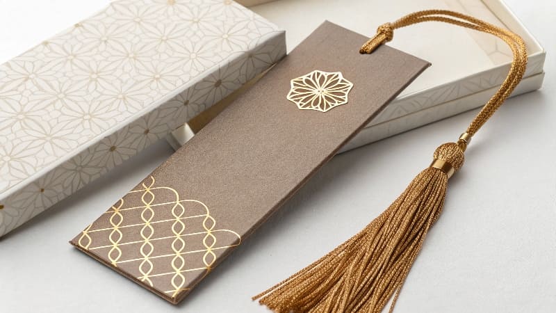 A high-end [promotional bookmark](https://wansapackaging.com/what-are-some-creative-bookmark-ideas/)<sup id=