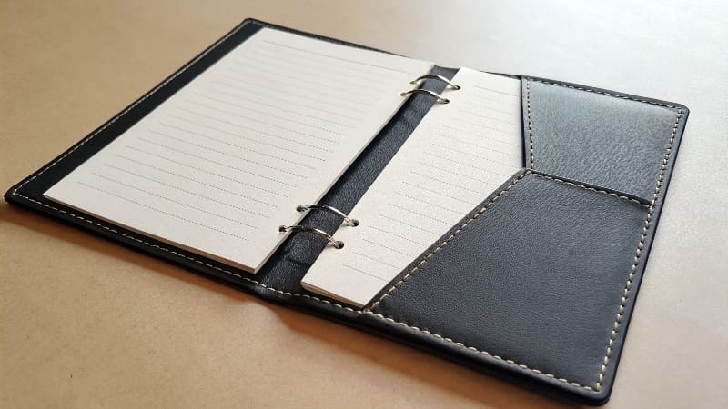A simple, black and white saddle-stitched [booklet](https://blog.printleaf.com/30-simple-expert-tips-for-designing-a-booklet-or-catalog/)<sup id=