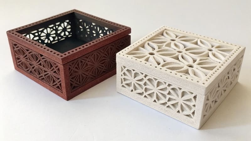 Custom Pantone Ink Matching for Boxes A technician in a print shop carefully mixing custom-colored ink.