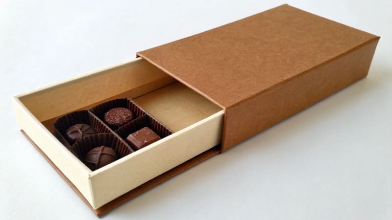 A close-up of different packaging textures: matte, gloss, and embossed paper.